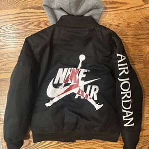 Used Boys Nike Air Jordan Bomber Jacket with built in Hoodie.